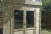 a wooden shed with glass doors